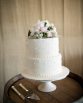 CLASSIC Cake Flowers consisting of roses, lisianthus, brunia berry and dusty miller.  Image by Alice Bell Photographics.