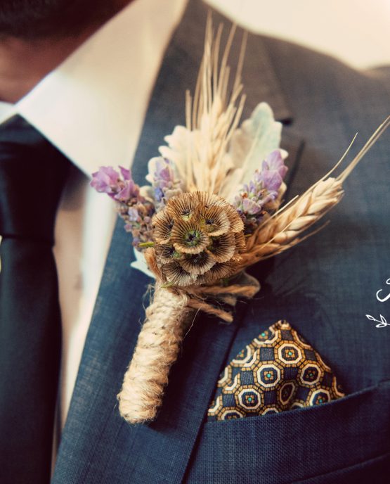 GARDEN buttonhole of scabiosa pods, lavender and wheat framed with dusty miller, finished with twine. Image by Kerin Burford Photography.