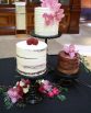 INDUSTRIAL Cake Flowers consisting of roses and pepper berry. Image by The White Orchid Floral Design.