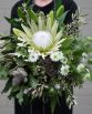 INDUSTRIAL Bridal Bouquet "Zoe" consisting of King protea, oriental lilies, native flowers, foliage and fern. Image by The White Orchid Floral Design.