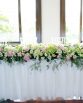CLASSIC Bridal Table Hedge (3 meters) consisting of hydrangea, roses, spray roses, peonies, ivy berry and pepper berry.  Image by The White Orchid Floral Design.
