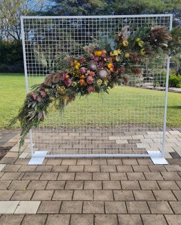 GATHERED Ceremony Floral Arch of seasonal natives and flowers.
